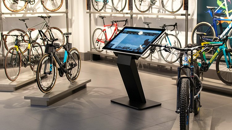 Interactive freestanding digital kiosk in bicycle shop