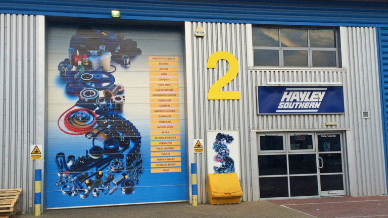 Self Adhesive Vinyl Graphics on Building Shutters Self Adhesive Vinyl Graphics on Building Shutters